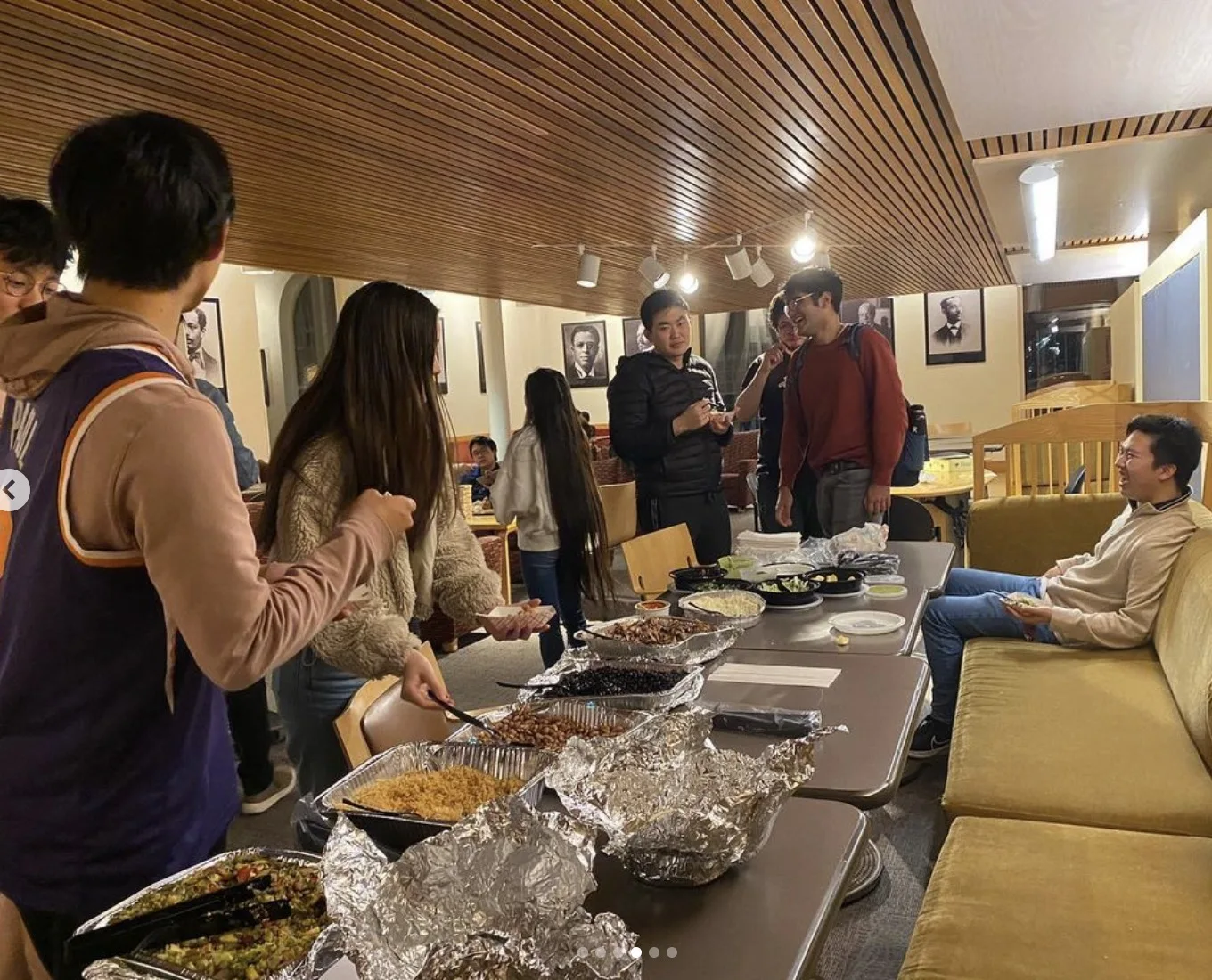 HCS members enjoying food together at a gathering
